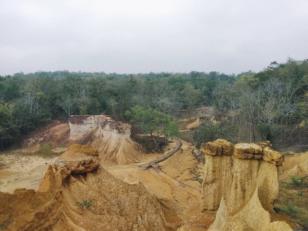 Phae Meuang Phi is a geological curiosity, some two million years of erosion have sculpted relatively soft red sandstone into intriguing rock formations.