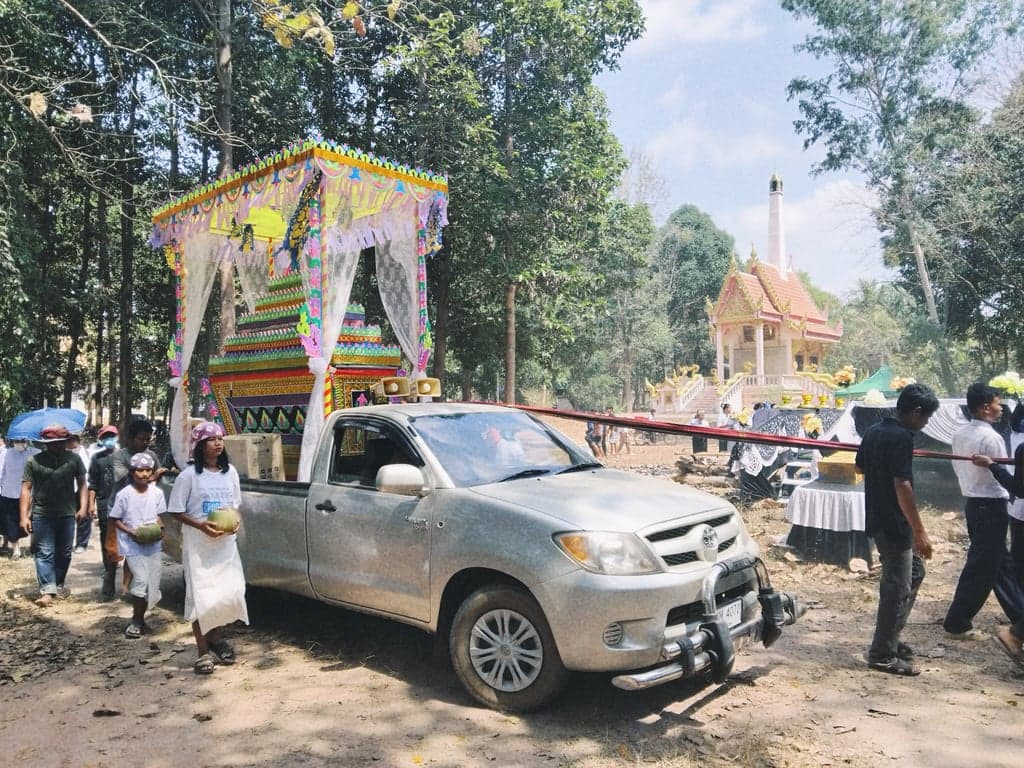 A traditional funeral ceremony with an open-air pyre at Phu Sing, Sisaket.