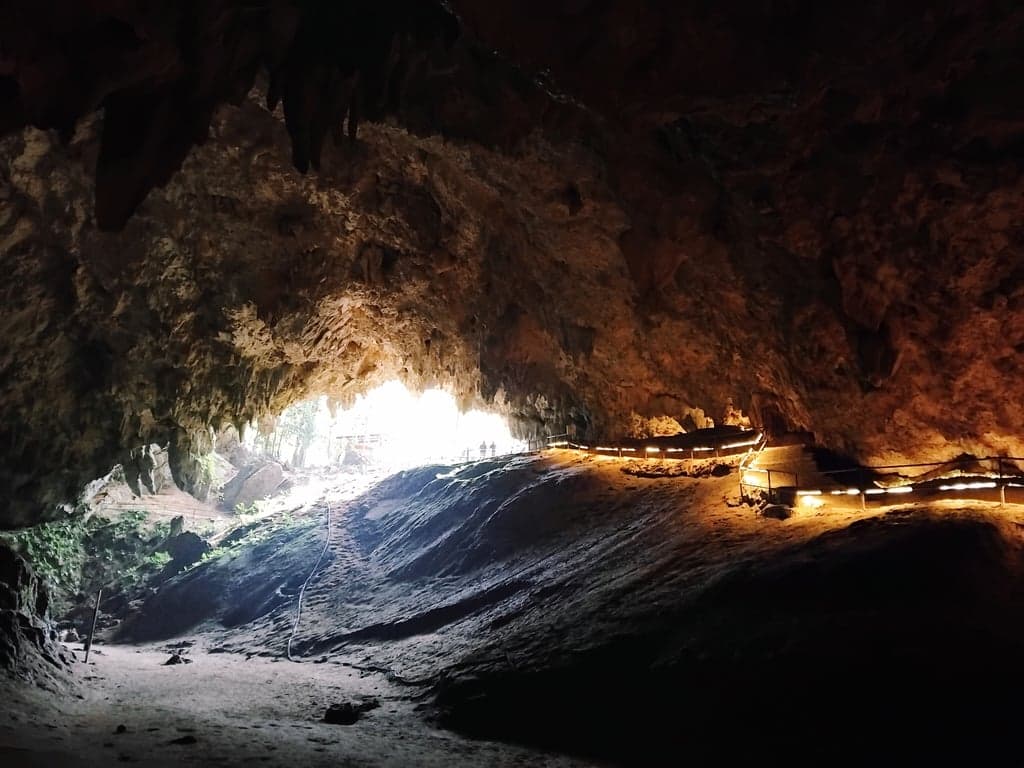 Exploring Tham Luang Cave, a famous site in Thailand known for the 2018 rescue of a youth soccer team and their assistant coach who were trapped deep inside the cave.